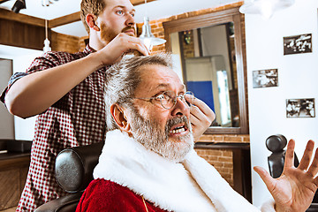 Image showing Santa claus shaving his personal barber