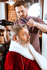 Image showing Santa claus shaving his personal barber