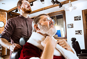 Image showing Santa claus shaving his personal barber