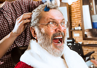 Image showing Santa claus shaving his personal barber