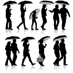 Image showing Black silhouettes man and woman under umbrella. 
