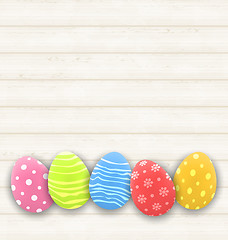 Image showing Easter colorful eggs on wooden texture