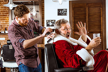 Image showing Santa claus shaving his personal barber