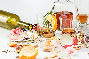 Image showing The morning after christmas day, table with alcohol and leftovers