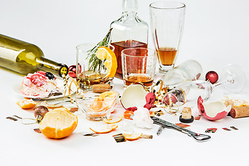 Image showing The morning after christmas day, table with alcohol and leftovers