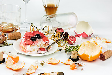 Image showing The morning after christmas day, table with alcohol and leftovers