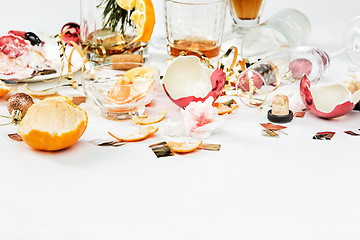 Image showing The morning after christmas day, table with alcohol and leftovers