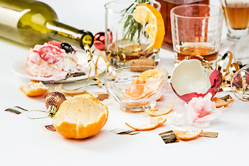 Image showing The morning after christmas day, table with alcohol and leftovers