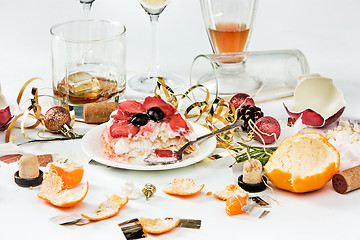 Image showing The morning after christmas day, table with alcohol and leftovers