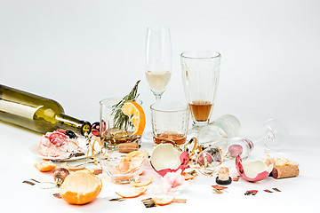 Image showing The morning after christmas day, table with alcohol and leftovers