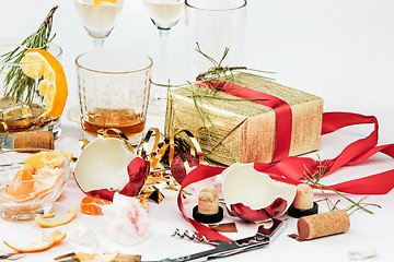 Image showing The morning after christmas day, table with alcohol and leftovers