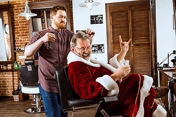 Image showing Santa claus shaving his personal barber