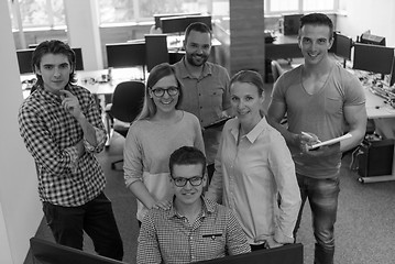 Image showing group of young startup business people standing as team