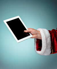 Image showing Santa Claus holding laptop