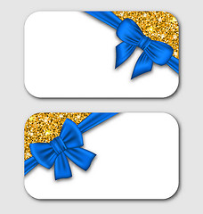 Image showing Gift Cards with Blue Bow Ribbon and Golden Surface.