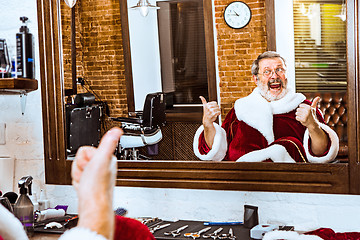 Image showing Santa claus shaving his personal barber