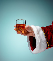 Image showing Santa Holding with a beer glass over blue