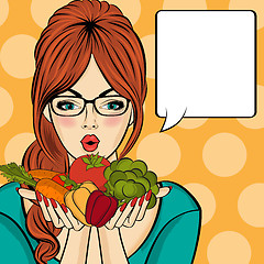 Image showing Surprised pop art  woman that holds vegetables  in her hands . C