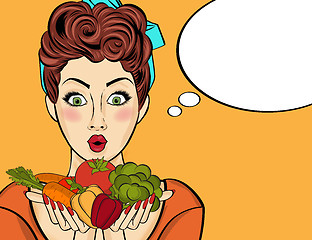 Image showing Surprised pop art  woman that holds vegetables  in her hands . C