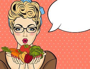 Image showing Surprised pop art  woman that holds vegetables  in her hands . C