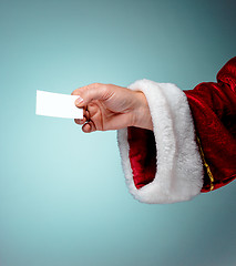 Image showing Photo of Santa Claus hand with a business card