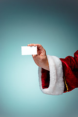 Image showing Photo of Santa Claus hand with a business card