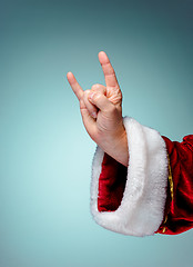 Image showing Photo of Santa Claus hand in rocker gesture