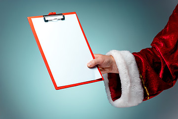 Image showing Photo of Santa Claus hand with a business tablet