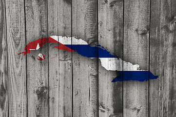 Image showing Map and flag of Cuba on weathered wood