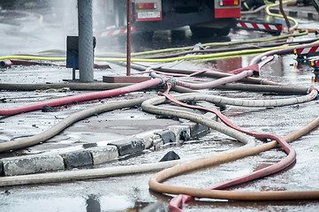 Image showing fire-prevention siphon or gate a tee and hoses for water are connected after firefight