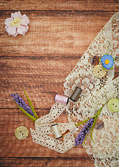 Image showing Lace and thread on wooden background