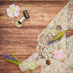 Image showing Lace and thread on wooden background