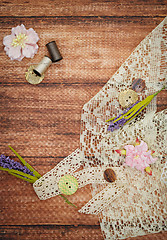 Image showing Lace and thread on wooden background