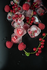 Image showing Frozen berries on wooden table