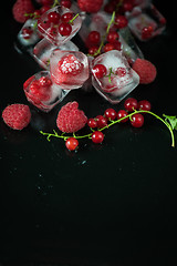 Image showing Frozen berries on wooden table