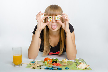 Image showing Young girl put roll your eyes and stuck out her tongue