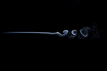 Image showing Smoke wave isolated on black. Smoke trail isolated on black. Horizontal smoke wave.