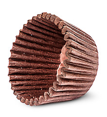 Image showing Stack of brown paper cups for baking muffins on the side