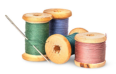 Image showing Needle and multicolored thread on wooden spool