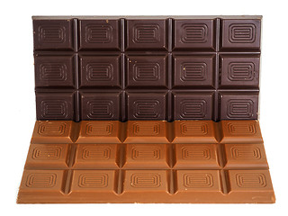 Image showing Person holding a whole bar of dark chocolate isolated towards wh