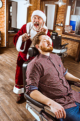 Image showing Santa claus as master at barber shop