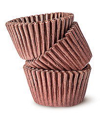 Image showing Heap of brown paper cups for baking muffins