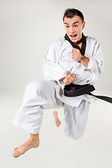 Image showing The karate man with black belt