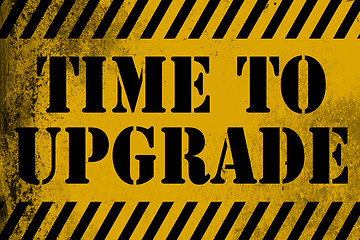 Image showing Time to upgrade sign yellow with stripes