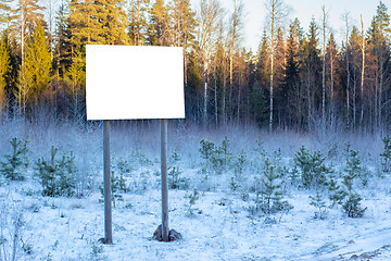 Image showing Blank billboard in winter woods