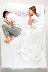 Image showing The young lovely couple lying in a bed