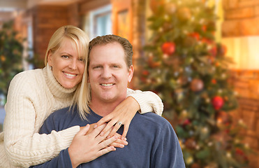 Image showing Loving Caucasian Couple Portrait In Front of Christmas Tree