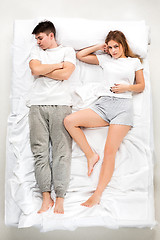 Image showing The young lovely couple lying in a bed