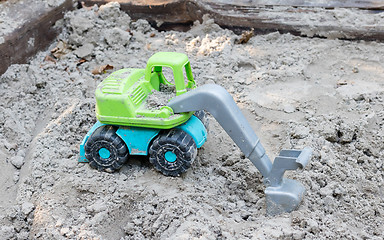 Image showing Toy trucks on sand