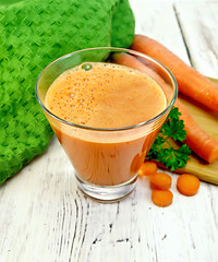 Image showing Juice carrot with vegetables and napkin on board